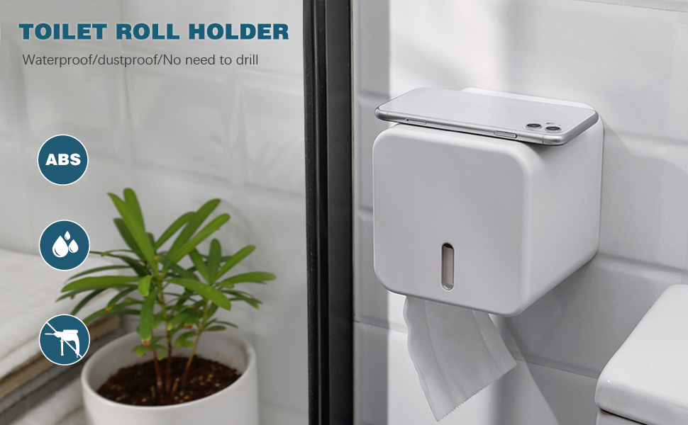 toilet paper holder with a plant in a bathroom