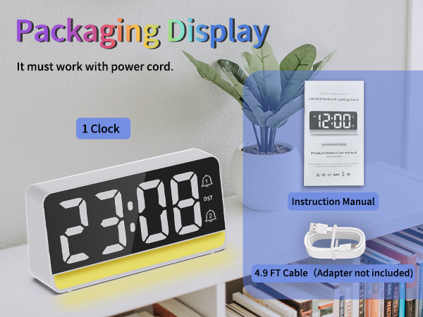 Includes: Clock, USB cable, manual. Requires power (no adapter included).