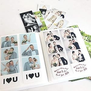photo booth album open with photos slided in
