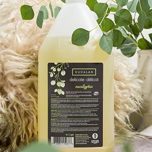 Eucalan's Eucalyptus delicate wash jug in front of a sheepskin.