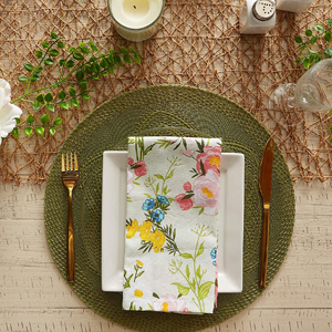 An image of a place setting complete with a green braided placemat