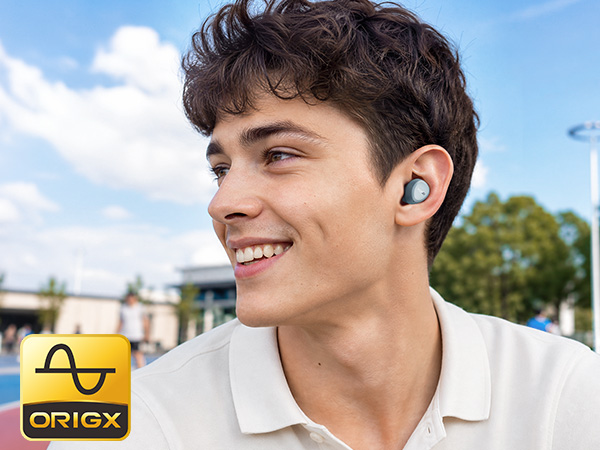 Person wearing TOZO A1 earbuds in everyday outdoor setting with OrigX tuned sound