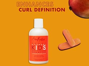 SheaMoisture Kids Shampoo bottle with carrots and mango on an orange background with text.