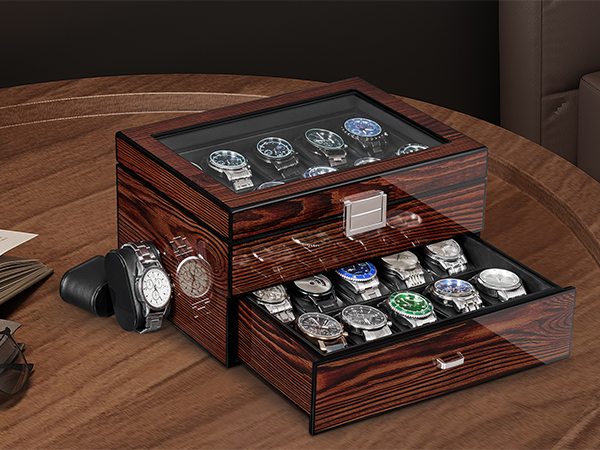 Dark wooden display case with multiple compartments showing organized watch collection against wood grain background.