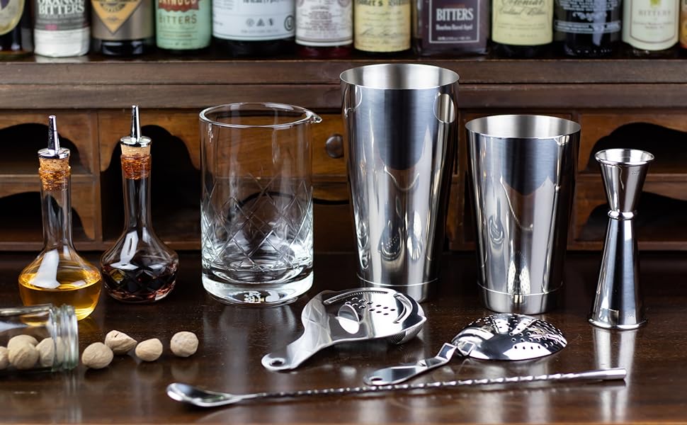 mixing glass, shaker tins, bar spoon, jigger, hawthorne strainer, julep strainer, bitters nutmeg