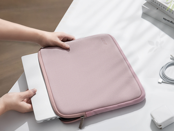 a woman opening a laptop case.
