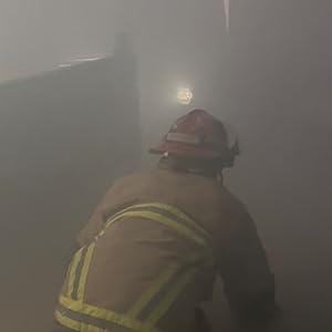 Firefighter searching and finds Rescue+Retriever