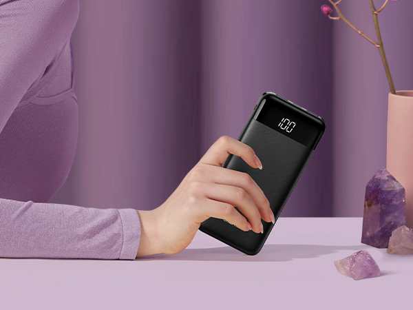 a woman holding a smartphone in her hand