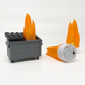 3D printed dumpster fire model with glowing orange flames, assembled and glued together
