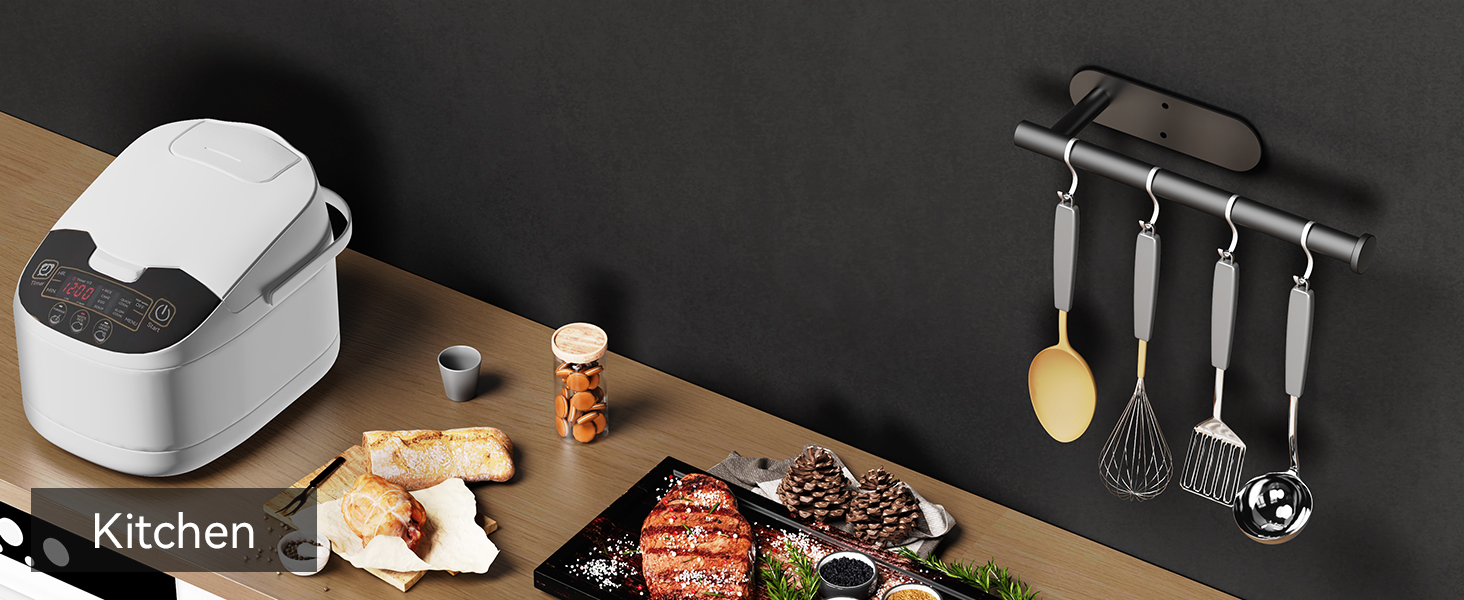 Black wall mounted holder used as kitchen utensil rail beside countertop appliances