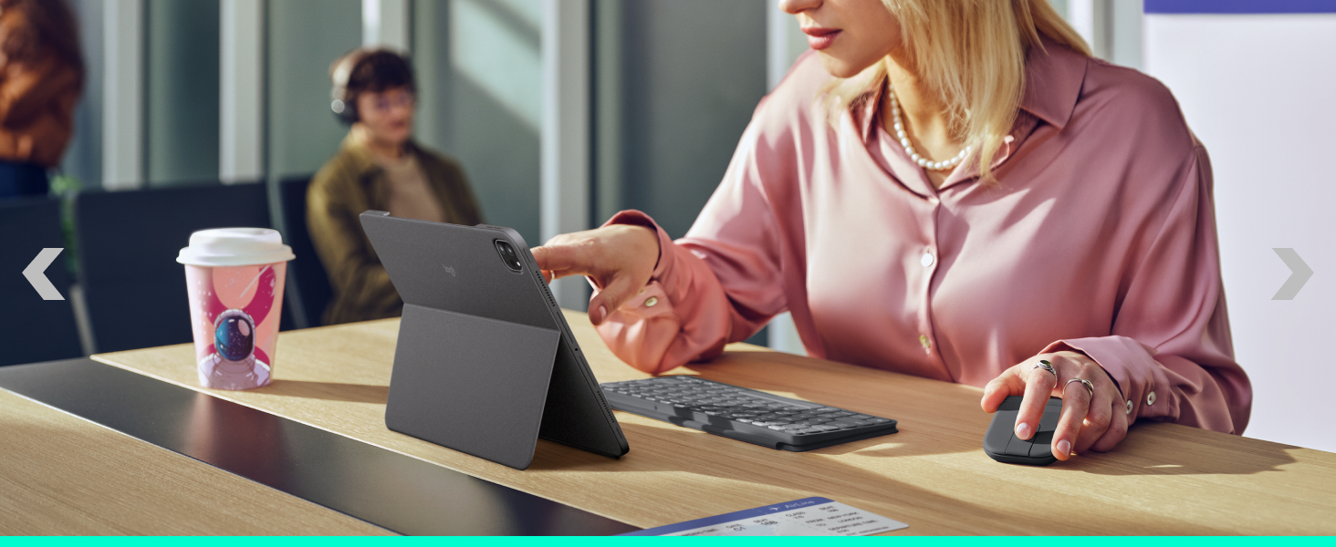 a woman holding a foldable mouse