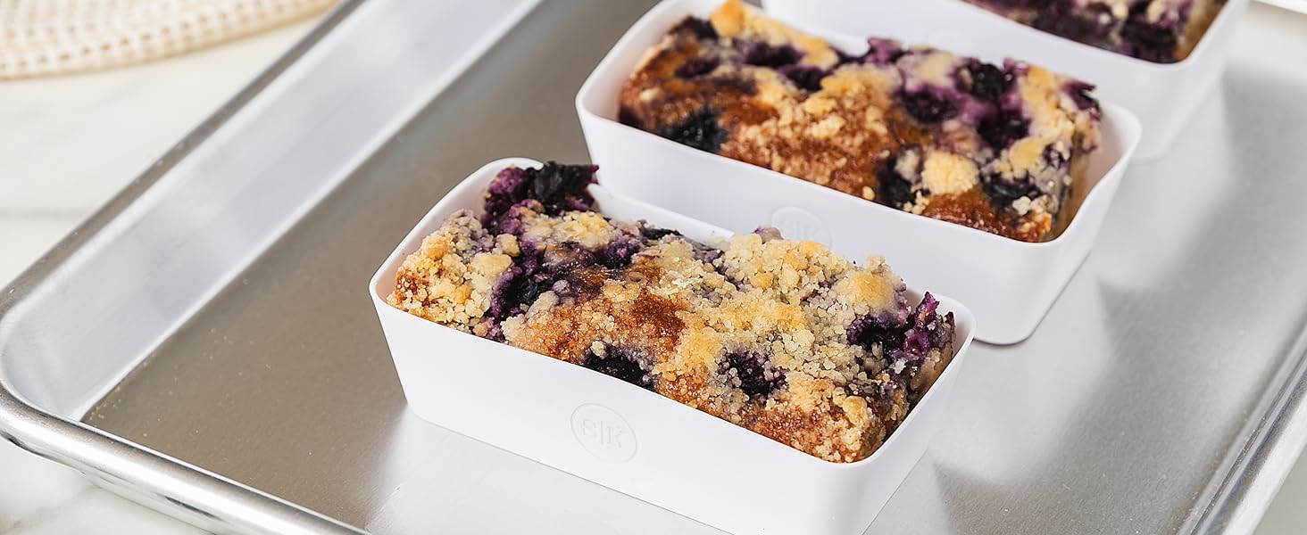 Designer white silicone baking cups with baked blueberry crumble