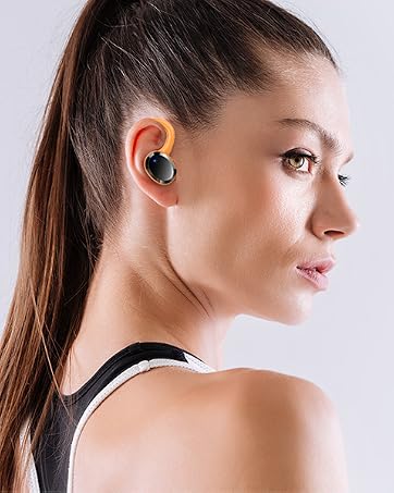Wireless earbuds with charging case showing orange accents. Product image displays both the earbuds in use and the opened charging case.