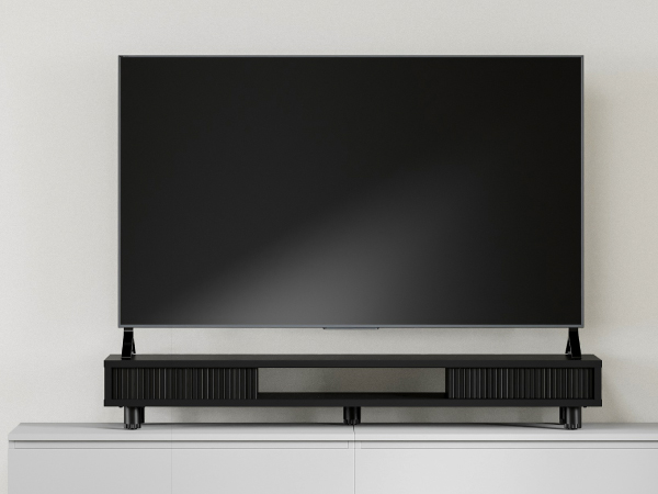 You can use it as a TV stand because the monitor stand riser is sturdy and stable enough