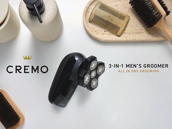 Cremo 3-in-1 Men's Groomer on a bathroom countertop with other bathroom accessories