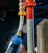 Camper hooking up their freshwater system with the Camco Tastepure rv water filter and hose