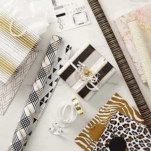 Elegant wrapping paper in black, white and gold, animal print gift bags