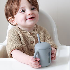 samigo baby holding a straw cup grey