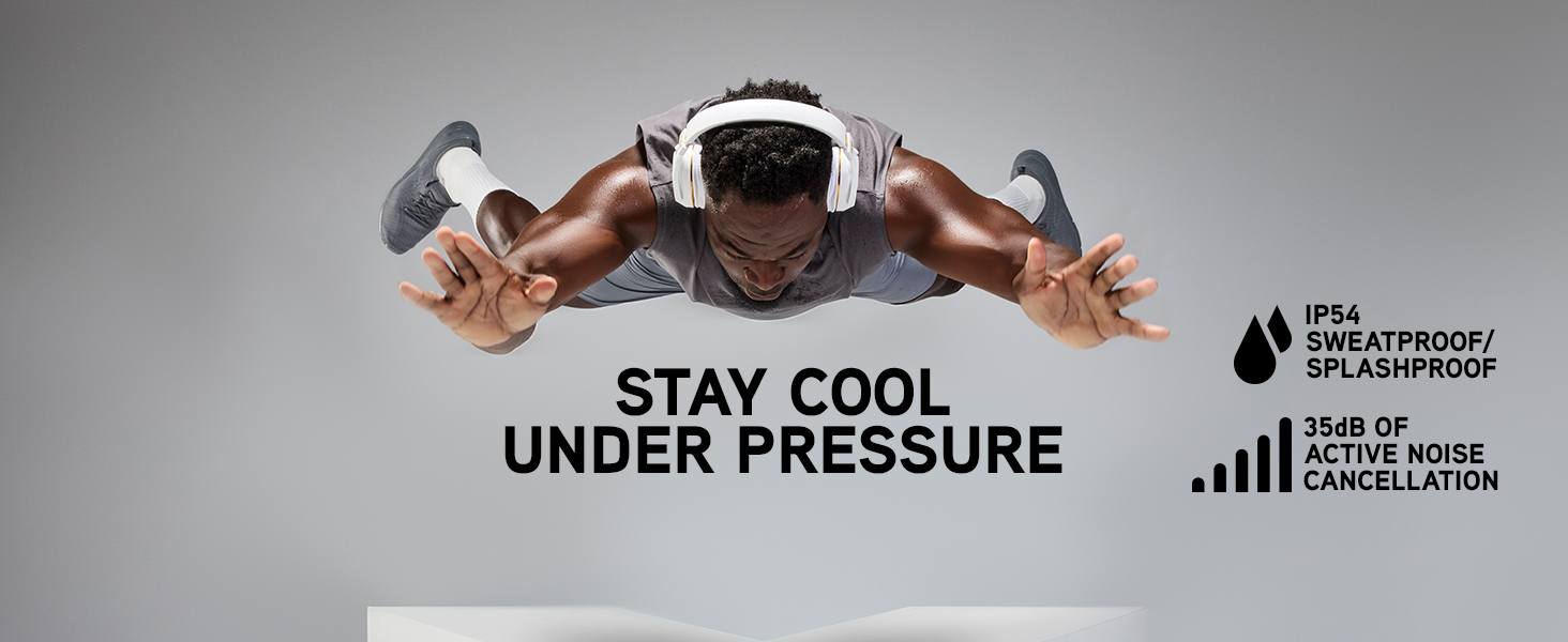 Athlete suspended in mid-air wearing white Pump X headphones above a large white X-shaped platform
