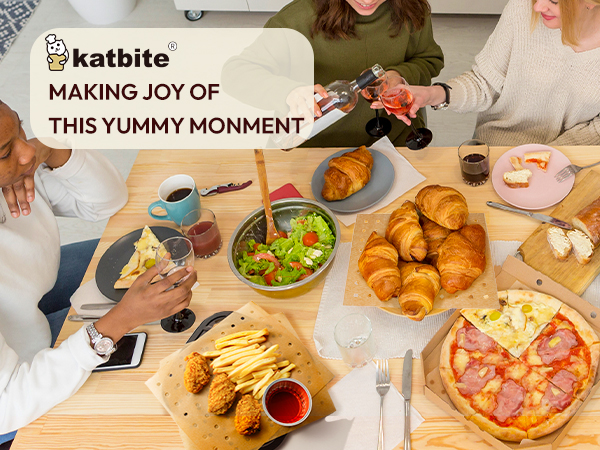 a group of people sitting around a table eating food.