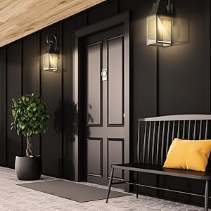 Medium shot of entryway at night and outdoor lights turned on for peace of mind thanks to schedules.