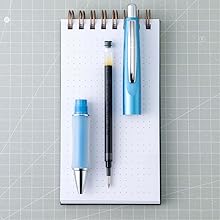 Photo shows de-constructed Dr. Grip Limited pen on a desktop