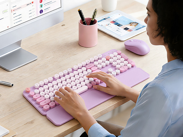 Office worker typing on a lavender retro round-keycap keyboard with wrist rest