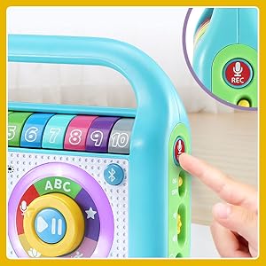 Kid pushes record button on music player to record voice.