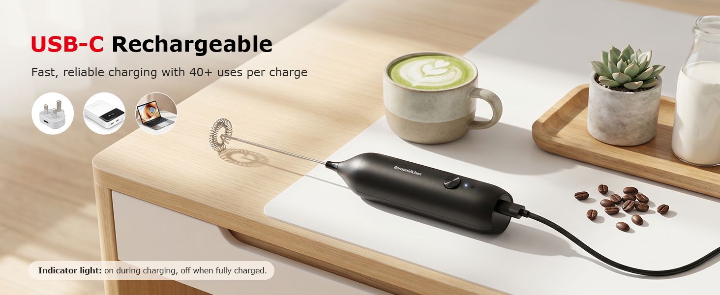 Text reads 'USB-C Rechargeable' and 'Pen, at-the-office, and at-home use.' Black USB-C rechargeable pen displayed with charging cable, desk accessories including coffee cup, small potted succulents, and scattered items on wooden surface.