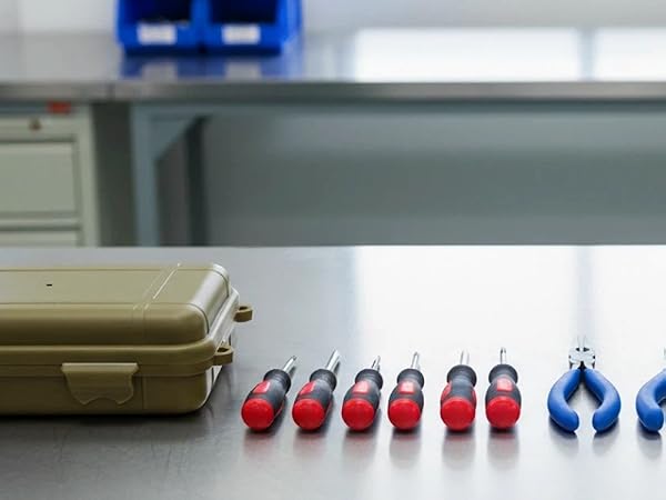 Case on workbench with tools and electronic components