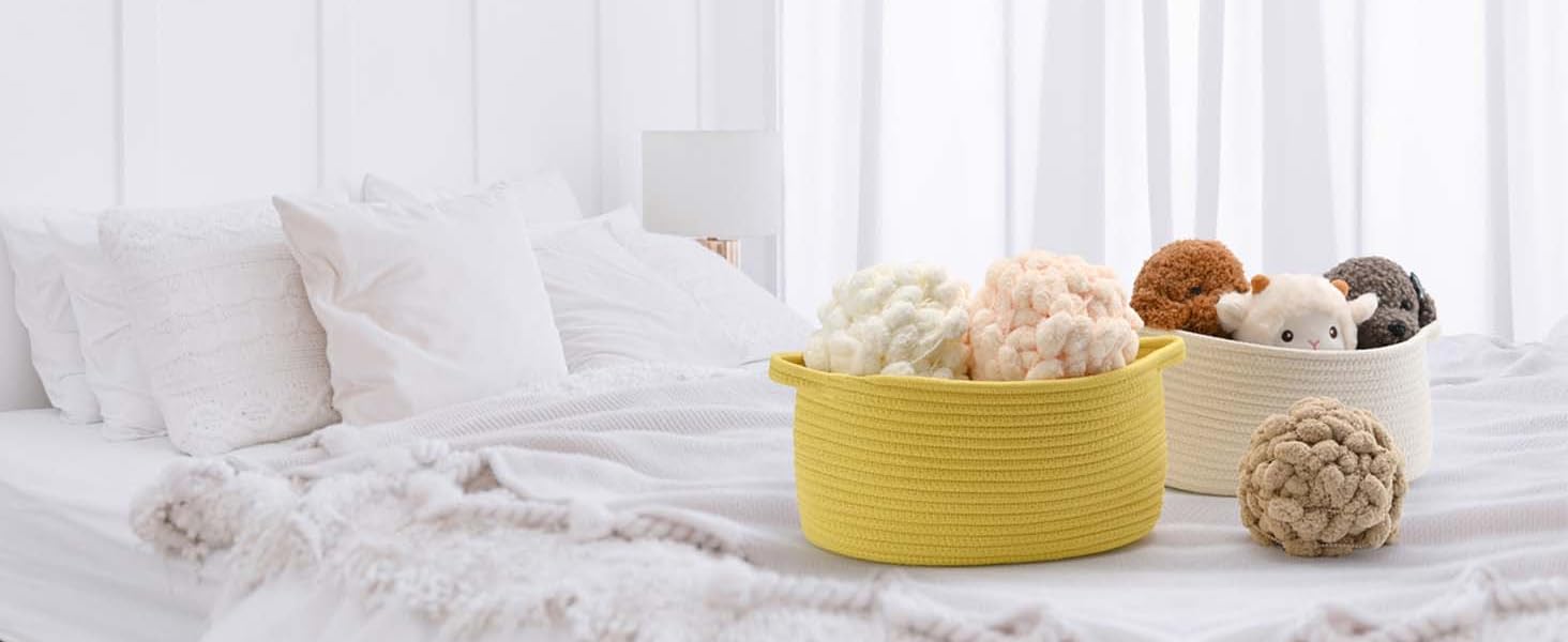 several storage baskets on the tidy bed, which are filled with wool balls and doll toys