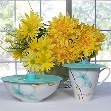 Teal silicone lids on cup and bowl.