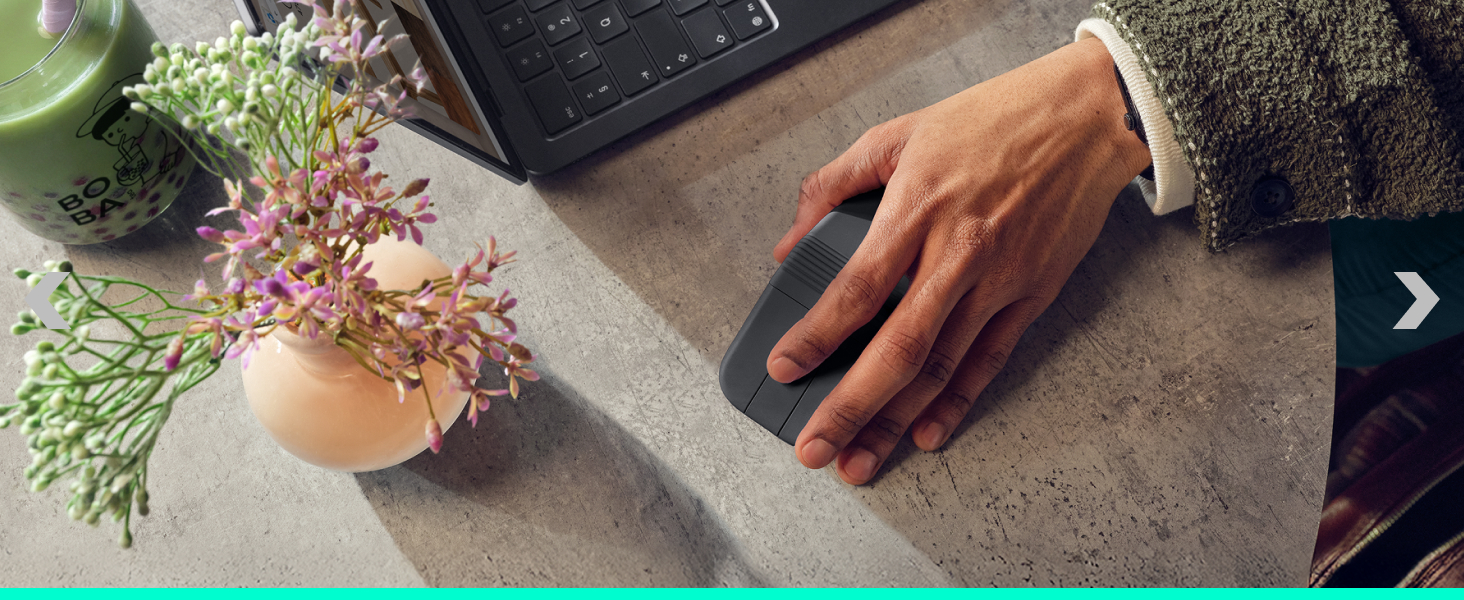 a person holding a foldable mouse