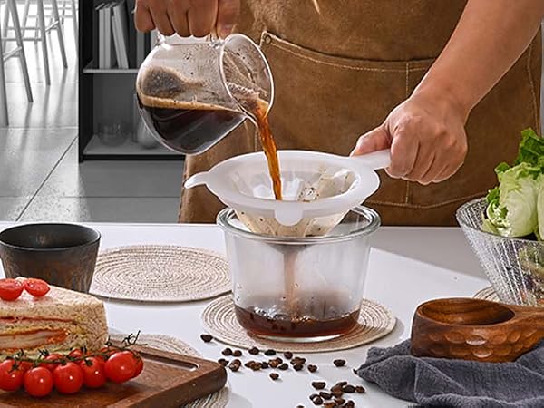 Coffee in the morning, woman brews coffee and drinks it, sandwich and coffee for breakfast