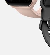Partial view of a device with curved pink and black components. Limited visibility prevents full product identification or description of functionality.