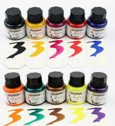 Set of colorful calligraphy inks in small glass bottles. Ten bottles displayed with corresponding ink swatches beneath, showing vibrant hues including black, yellow, pink, red, blue, orange, and purple.