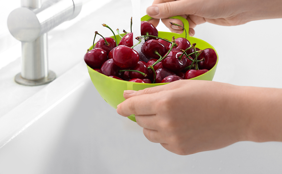 washing cherries using a mini colander