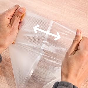 A bag with one smooth side and one textured side is pulled down by the hand to keep it tight