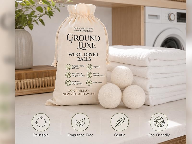 Premium wool dryer balls with folded towels in a luxury laundry room