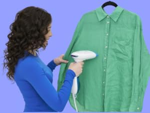 Woman steaming shirt