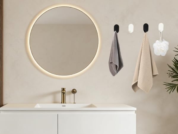 Large circular LED mirror mounted on beige wall above white cabinet, showing different lighting settings and configurations in bathroom setting.