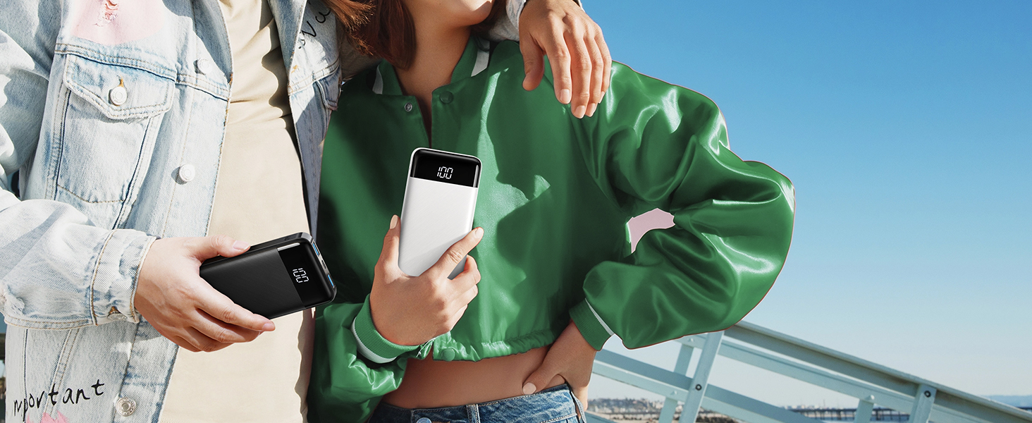 a woman holding a cell phone in her hand