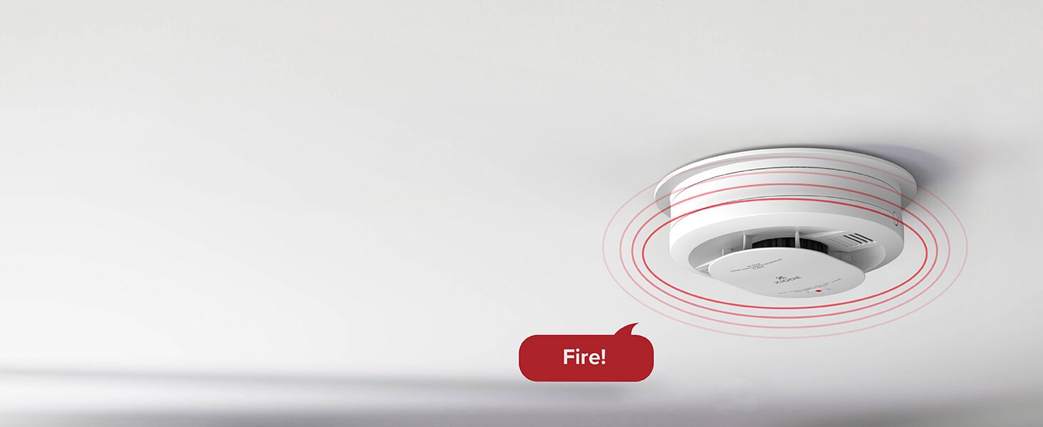 Kidde hardwired + AA battery backup smoke detector with voice alert announcing fire - desktop