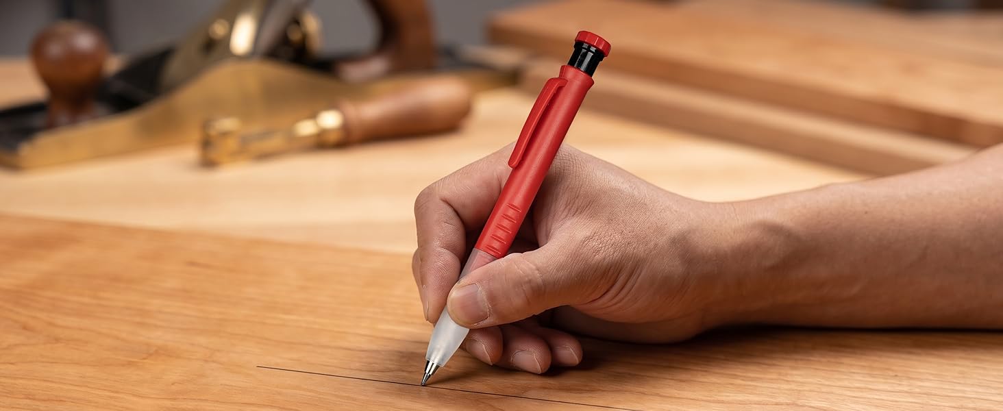 Drawing a precise, fine line on a wooden surface.