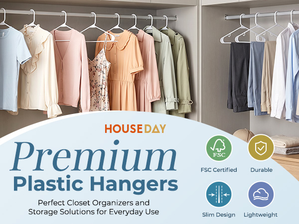 White plastic hangers holding shirts, long dress, and pants. Sleek uniform look. Perfect for scloset
