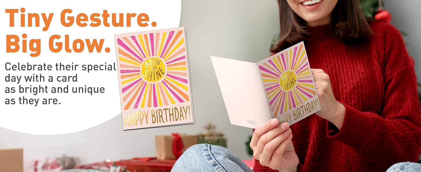 birthday card being read with envelope and gold sticker shown