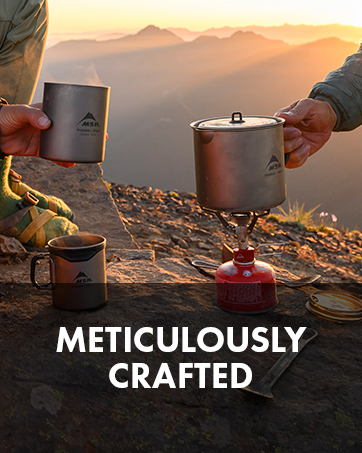 Person cooking eggs on a backpacking stove