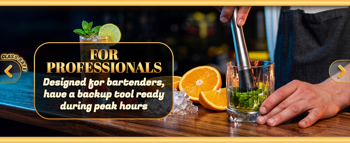 Bartender using cocktail muddler with mint in glass at bar