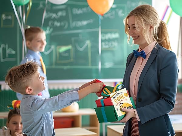 Teacher receives colorful thank you cards teacher along with a wrapped present from a student.