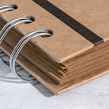 Hard cover to protect plain kraft pages
